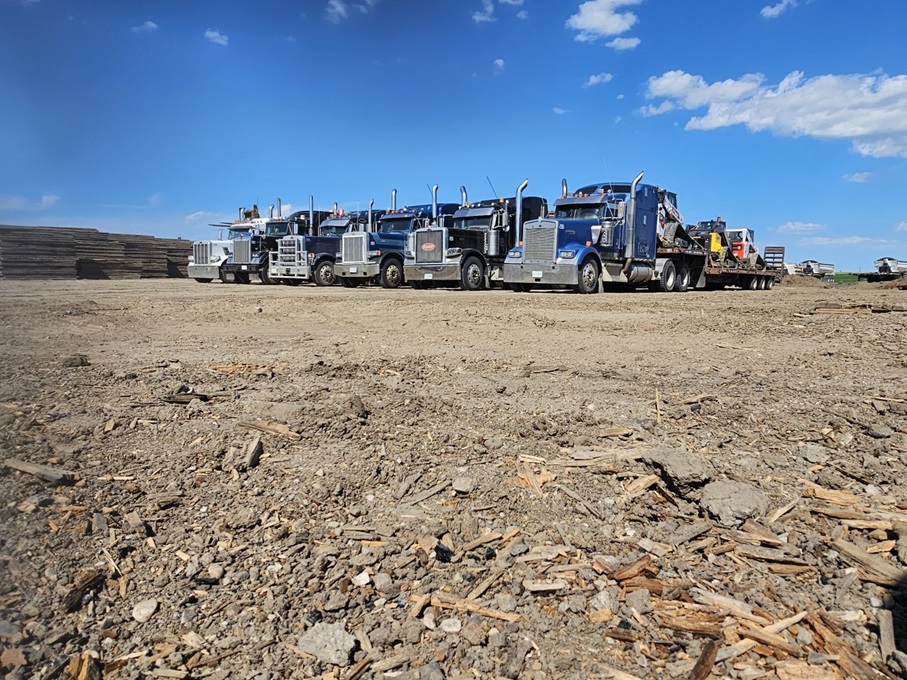 trucks lined in yard loaded with access mats and equipment trucks lined in yard loaded with access mats and equipment